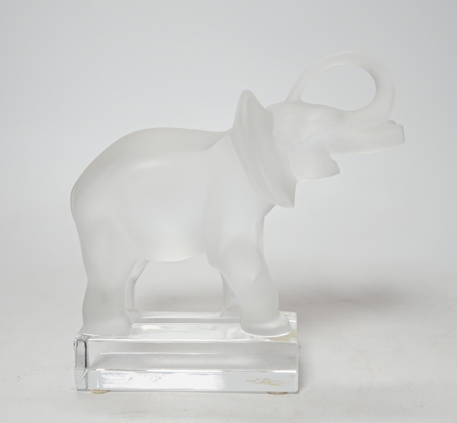 A Lalique frosted glass model of an elephant, signed to the base, 16cm high